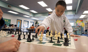TM 3rd-grader Roland Feng faces 16 players simultaneously in the Library in 2010.